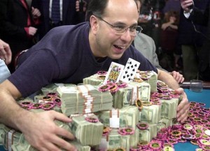 Robert Varkonyi of Brooklyn, N.Y., poses with his $2 million dollar winnings Friday, May 24, 2002, at the Binion's Horshoe Casino in Las Vegas. Varkonyi won the 33rd World Series of Poker against  his final opponent Julian Gardner, of England.  The queen and ten card on the money was his winning hand in the no-limit Texas hold-em game.(AP Photo/Joe Cavaretta)