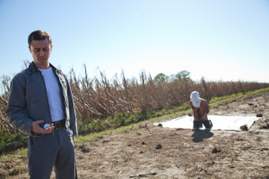 Joseph Gordon-Levitt and Bruce Willis as "Joe" in TriStar Pictures, Film District, and End Game Entertainment's action thriller LOOPER.